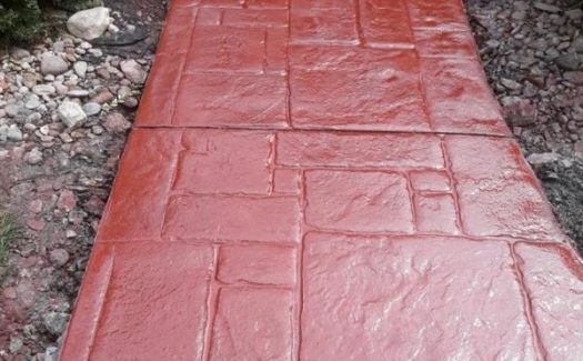 red-stamped-paver-concrete-walkway